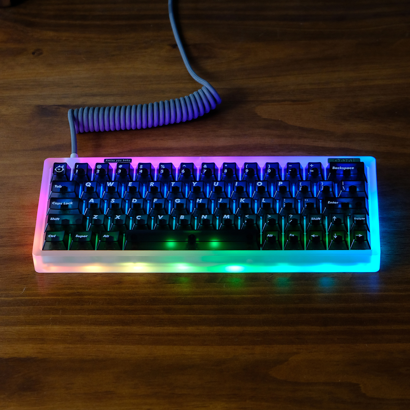 Keyboard with RGB lighting on a wooden surface